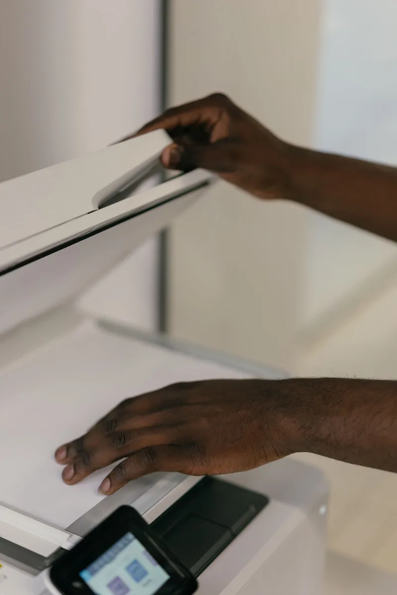 Careful handling of printed pages while preparing readable document copies