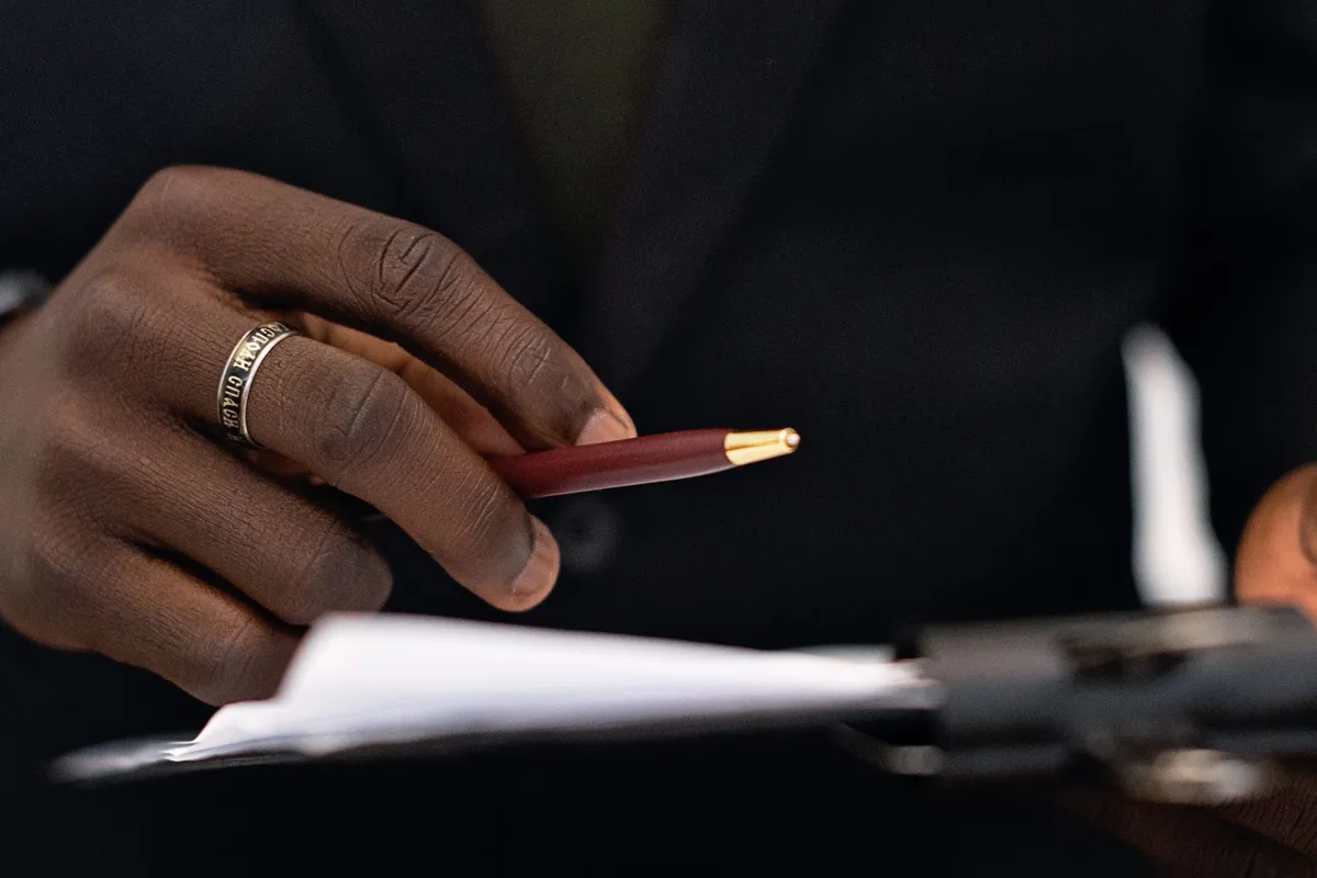 Printed document pages being reviewed before arranging a birth certificate translation
